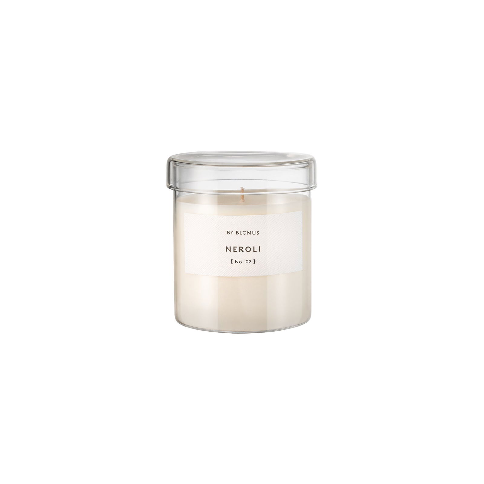 Weißes Neroli-Duftkerze in einem klaren Glasbehälter von Blomus.