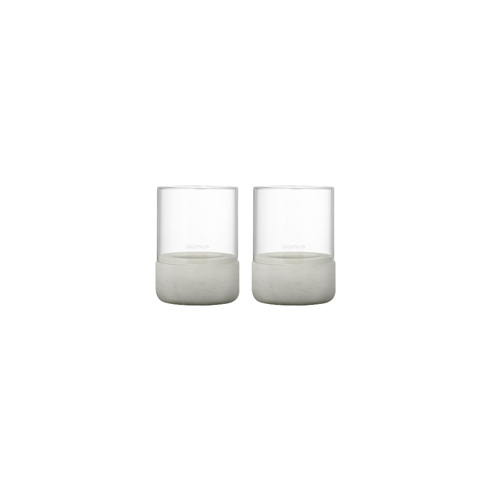 Set of two modern glass candles with elegant concrete bases for stylish decor.