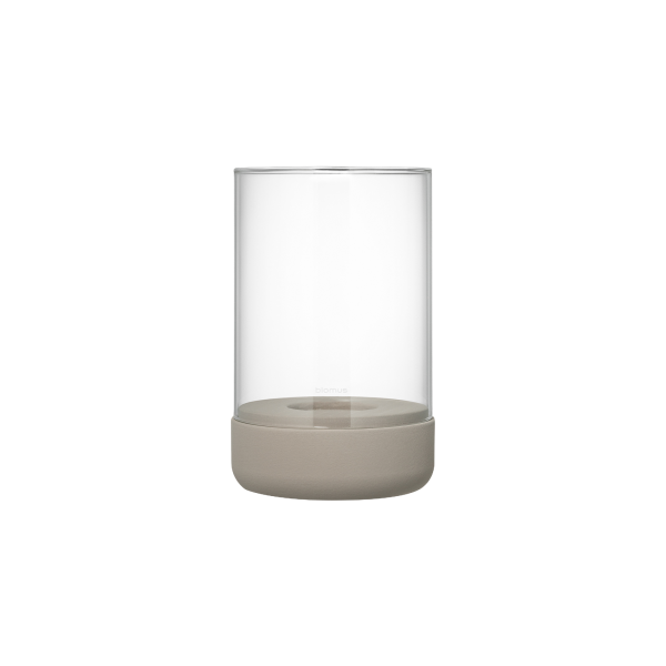 Elegant glass vase with a minimalist beige base, perfect for modern decor.