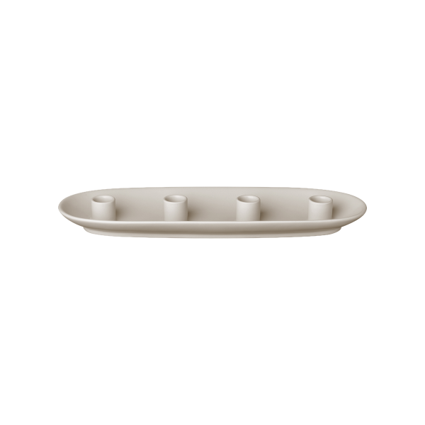 Modern minimalist ceramic candle holder with three holders in a sleek oval design.
