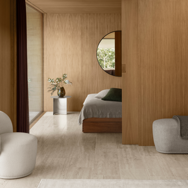 Modern bedroom interior with wooden walls, stylish furniture, and natural light.