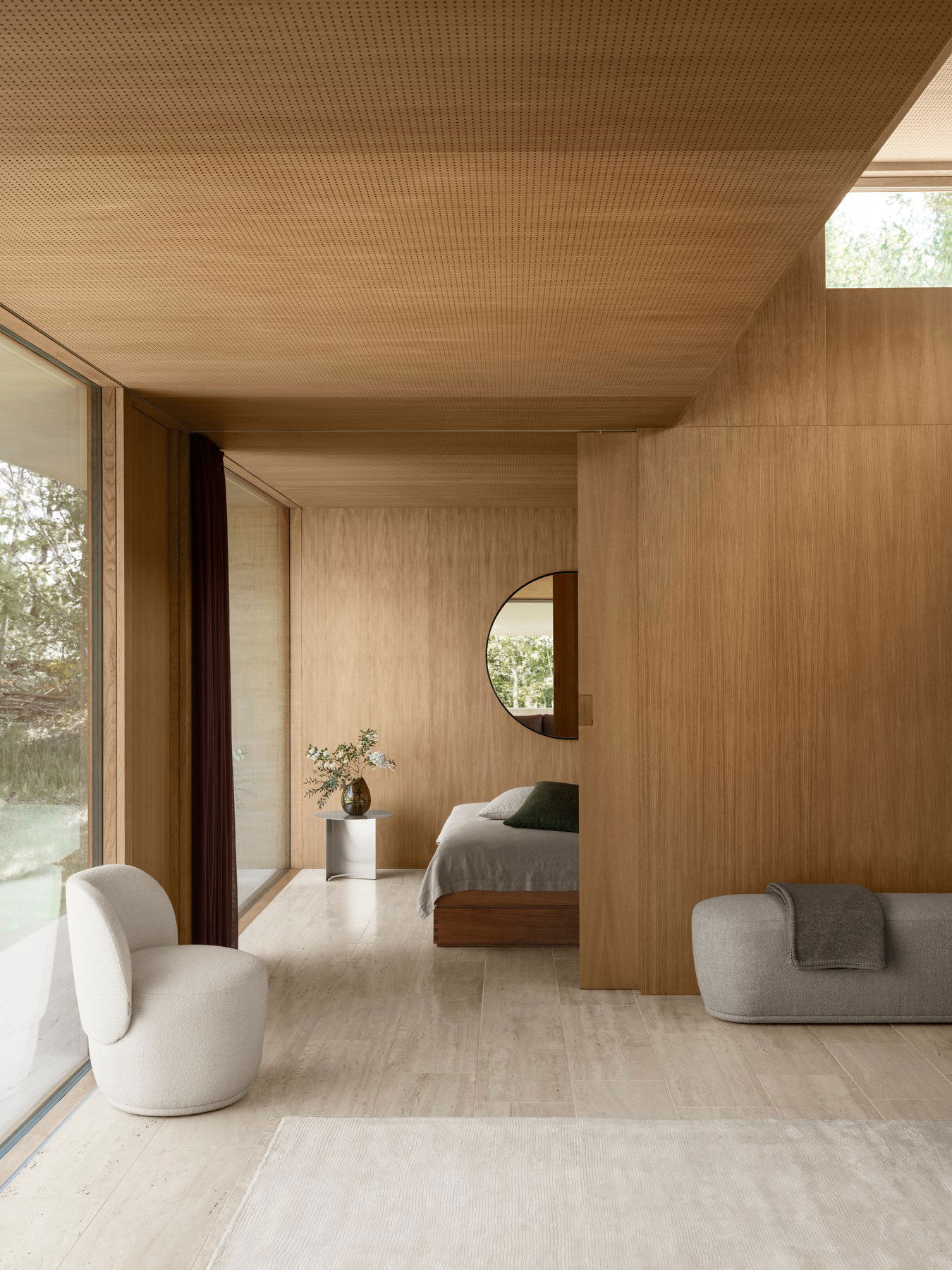 Moderner Schlafzimmerinnenraum mit Holzelementen und stylischer Möbeln, durchflutet mit natürlichem Licht.