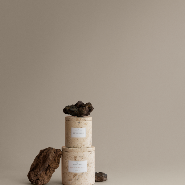 Elegant stacked natural stone candle holders on a neutral background showcasing minimalist design.
