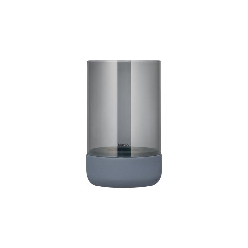 Minimalist glass vase with a sleek design and dark base for contemporary decor.