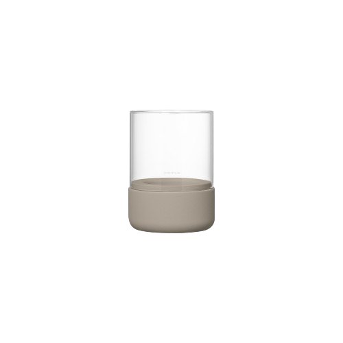Small glass with a light brown base, set against a plain white background.