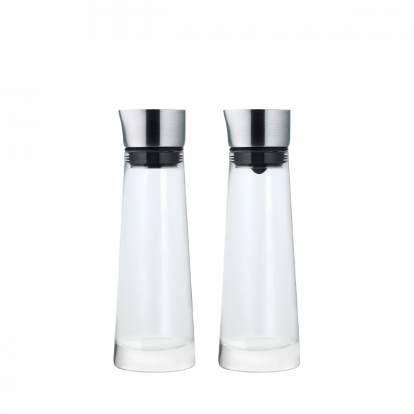 Two elegant glass carafes with stainless steel lids on a black background.