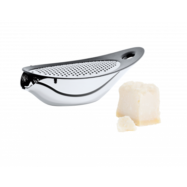 Stainless steel cheese grater with a piece of parmesan cheese on a black background.
