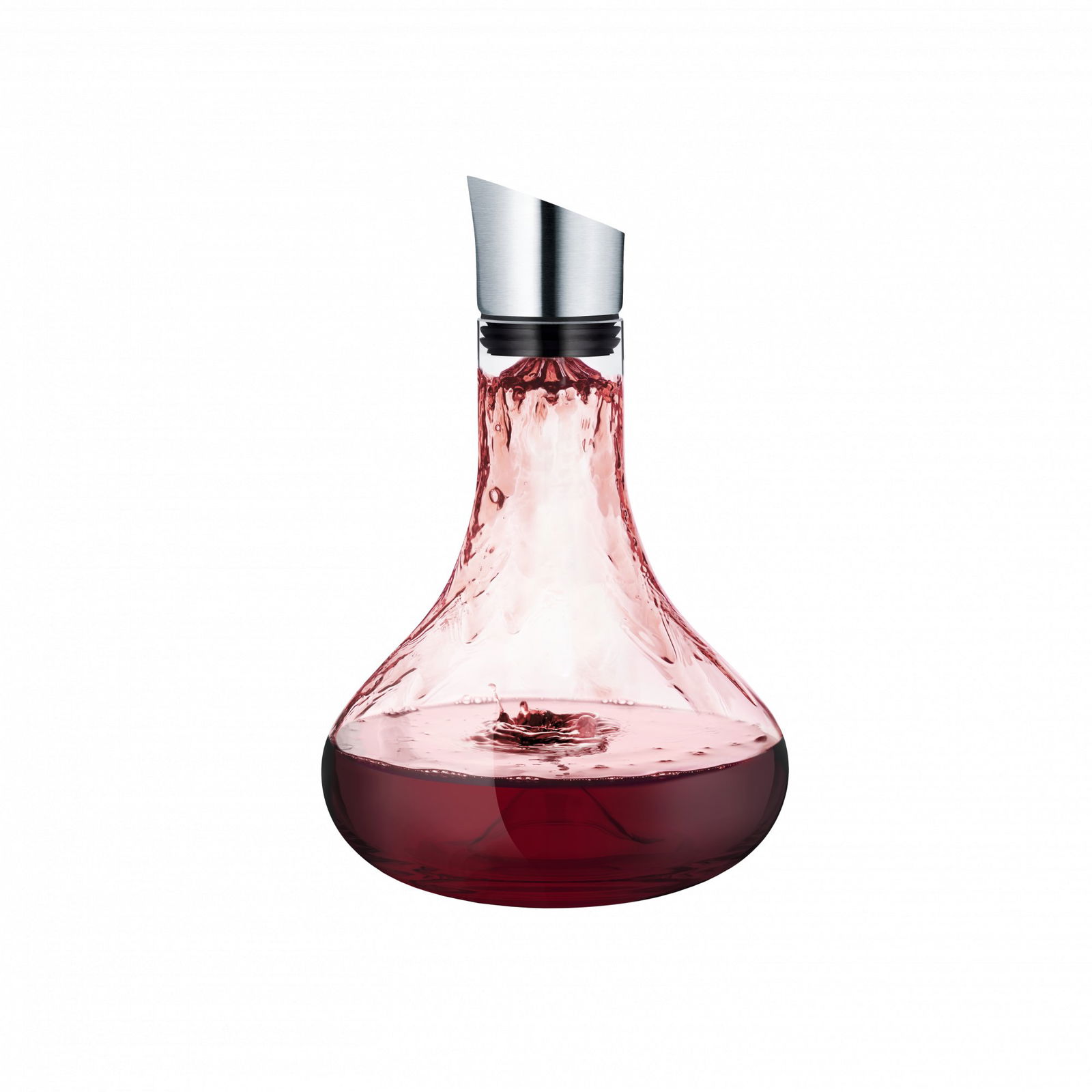 Elegant glass wine decanter pouring rich red wine.