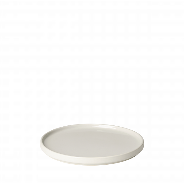 Weißer Keramikteller mit glatter Oberfläche und minimalistischer Gestaltung auf schwarzem Hintergrund.