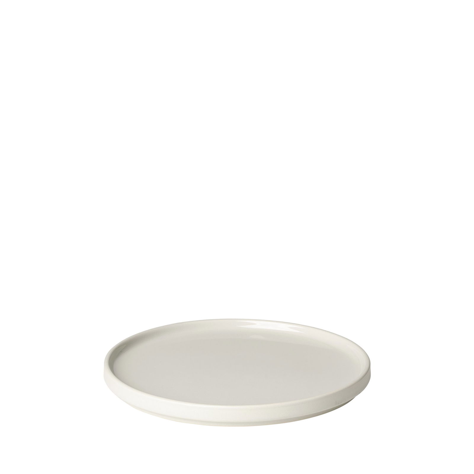 Weißer Keramikteller mit glatter Oberfläche und minimalistischer Gestaltung auf schwarzem Hintergrund.