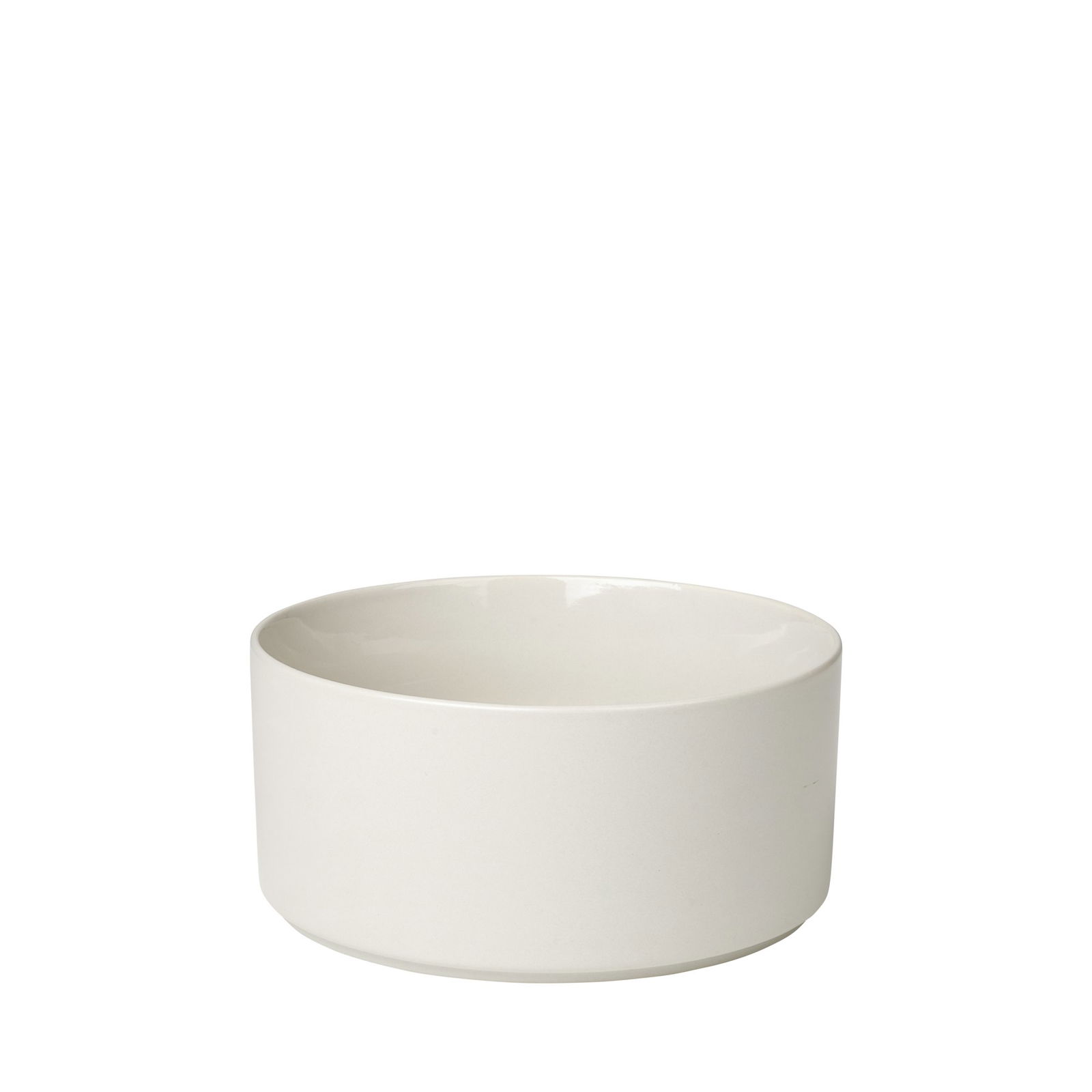 Minimalist white ceramic bowl with a smooth, curved design on a black background.