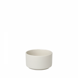 Simple ceramic bowl in a minimalistic design against a black background.