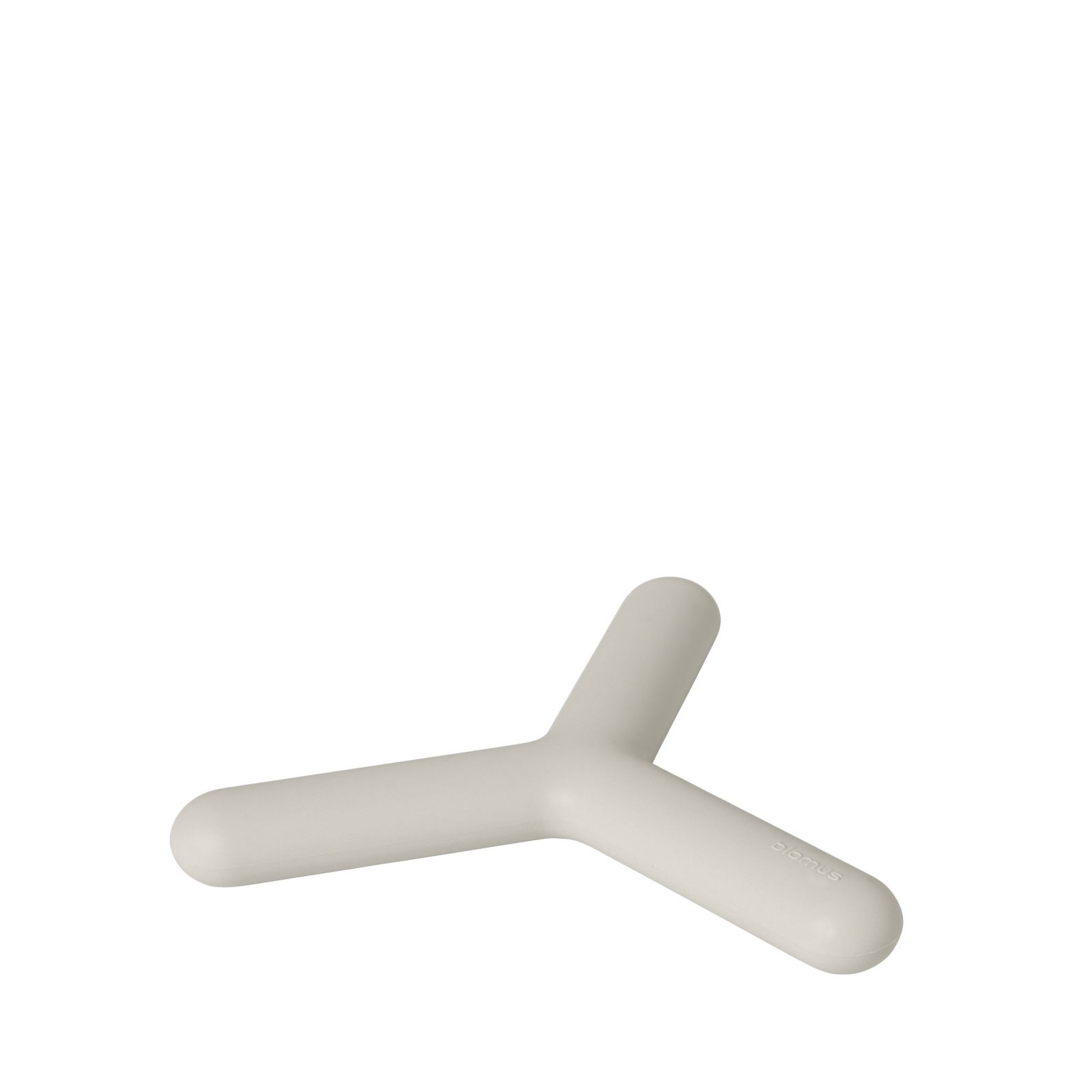 Minimalist beige desk accessory shaped like a Y on a black background.