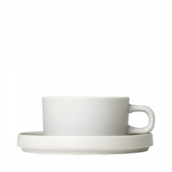 Minimalist white coffee cup with saucer on a black background.