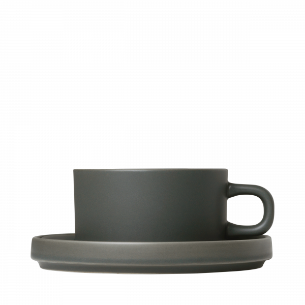 Stylish dark ceramic coffee cup with a matching saucer on a black background.