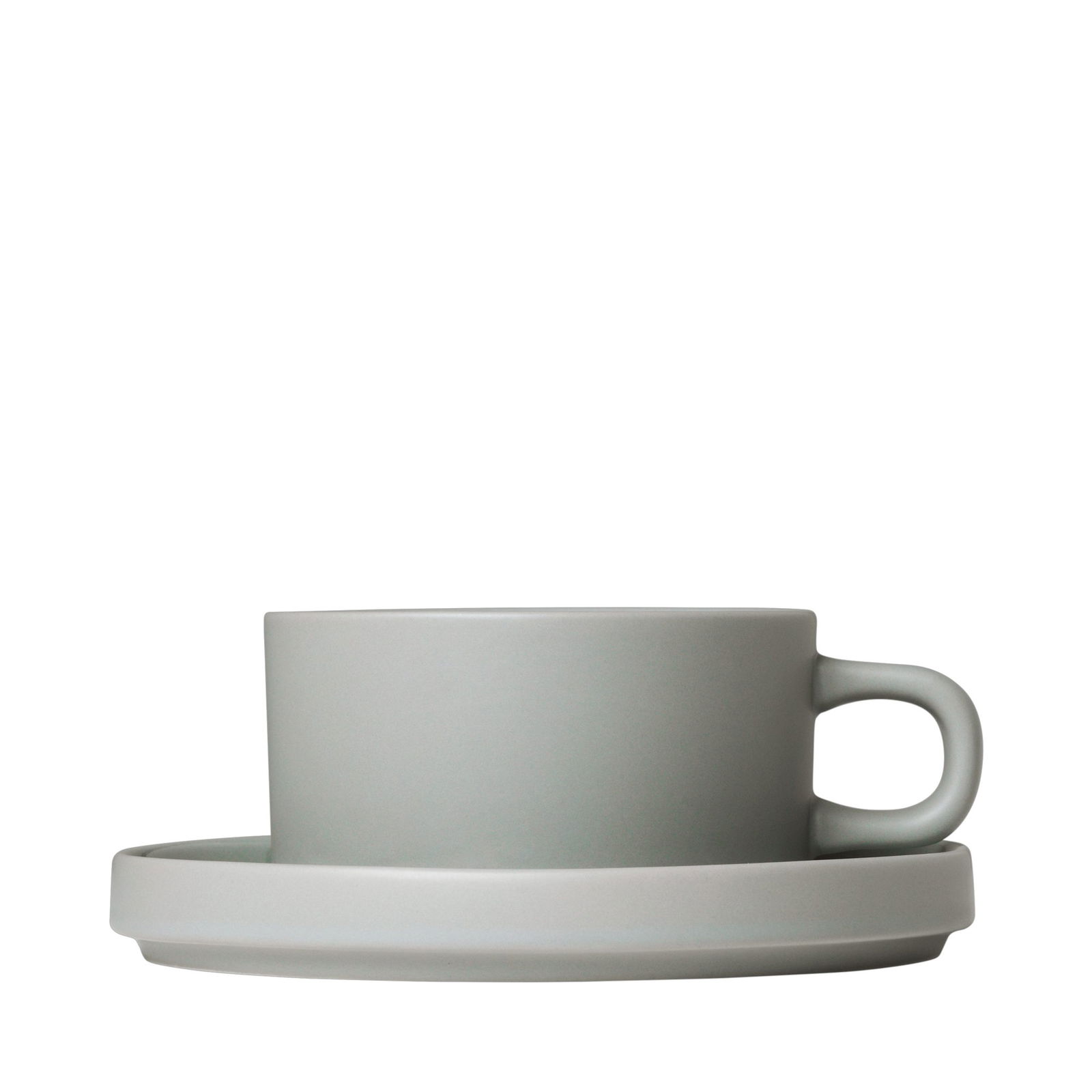 Minimalistische graue Tasse mit Untertasse auf schwarzem Hintergrund, perfekt für stilvolles Essen.