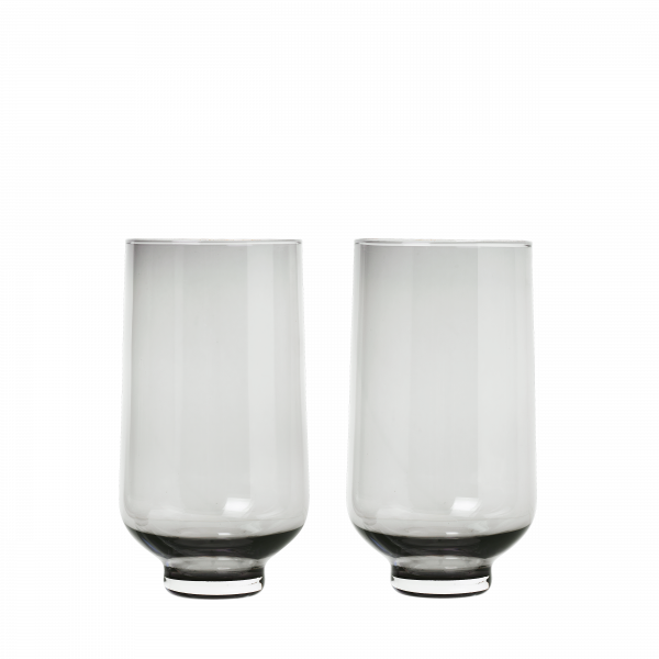 Two elegant glass tumblers with a modern design on a black background.
