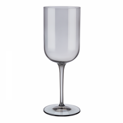 Elegant clear wine glass with a tall stem and modern design on a black background.