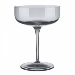 Elegant clear glass cocktail coupe on a black background for stylish drink presentations.