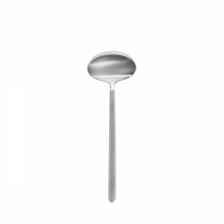 Shiny stainless steel soup ladle on a black background.