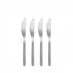 Four sleek silver knives arranged neatly on a black background.