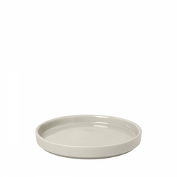 Minimalist round ceramic plate in soft gray color, perfect for serving or décor.
