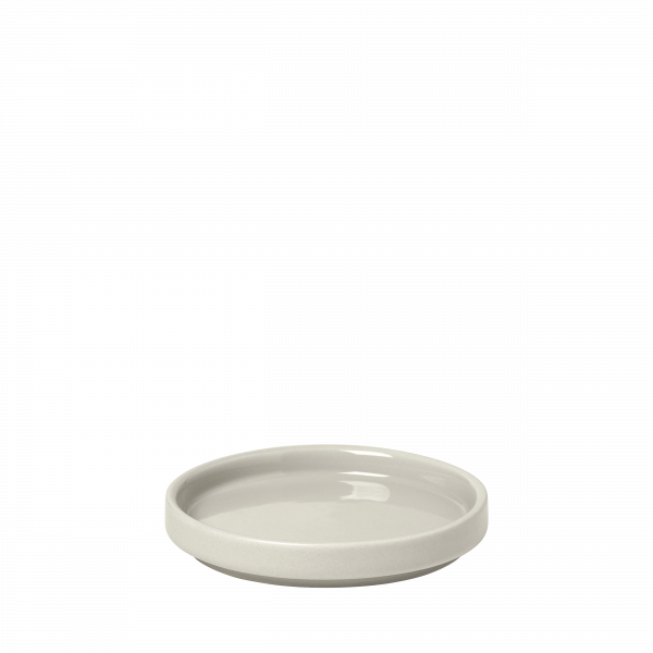 Minimalist ceramic plate in soft gray ideal for serving or decorative purposes.