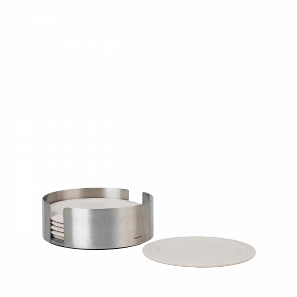 Stylish stainless steel coaster set with matching white plates on a black background.