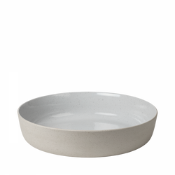Modern ceramic serving bowl with a minimalist design and smooth white interior.
