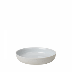 Elegant round white ceramic bowl with a speckled finish on a dark background.
