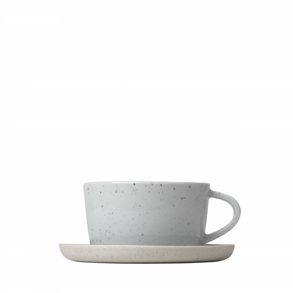 Minimalist gray coffee cup with saucer on a black background.