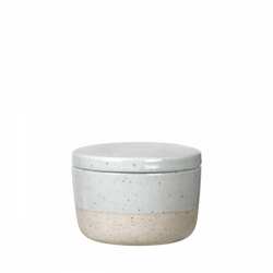 White and beige ceramic jar with lid, featuring a speckled design.