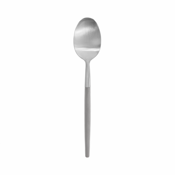 Silver spoon against a black background, highlighting its sleek design and shine.
