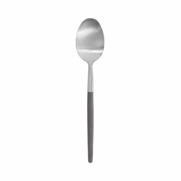 Silver stainless steel spoon on a black background, showcasing a sleek design.