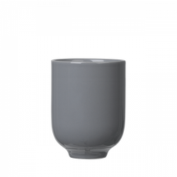 Sleek gray ceramic cup with a minimalist design on a black background.