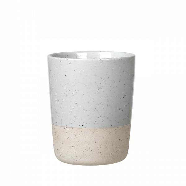 Ceramic cup with a speckled gray top and a beige bottom, perfect for modern home decor.