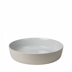 Plain white ceramic bowl with a smooth interior and textured exterior, ideal for serving.