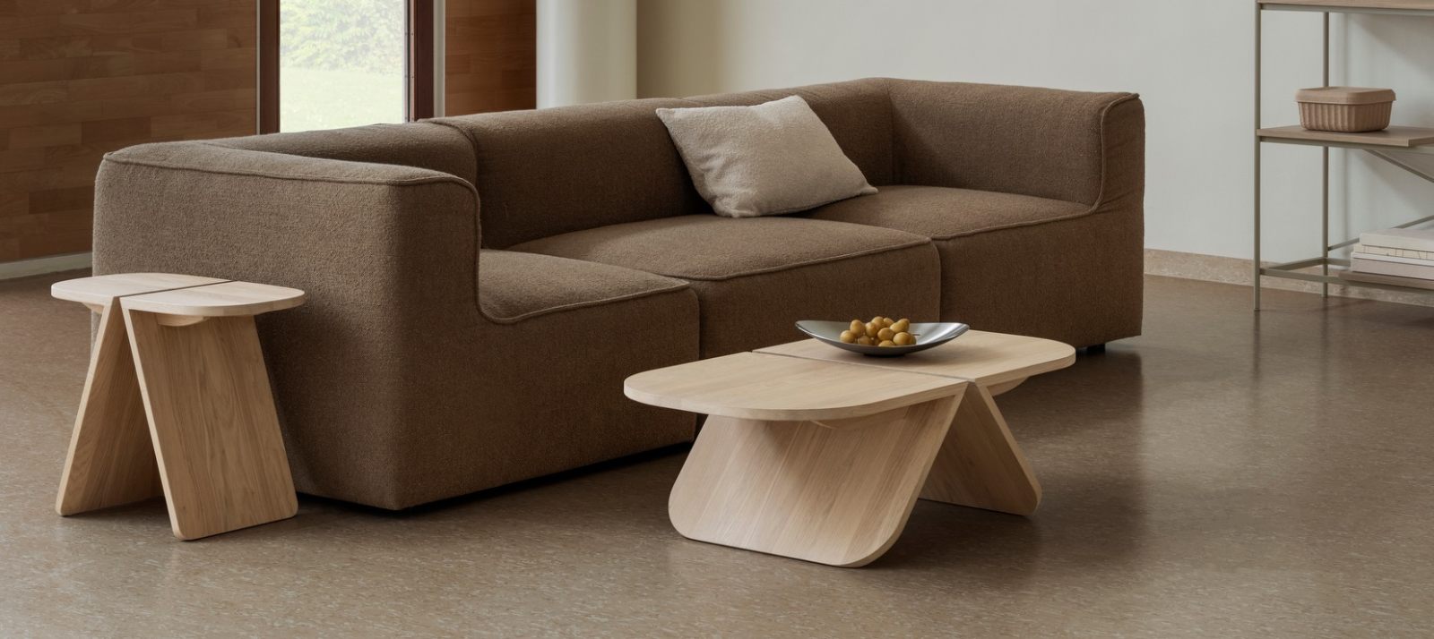 Cozy living room with a brown sofa and modern wooden coffee tables for stylish decor.