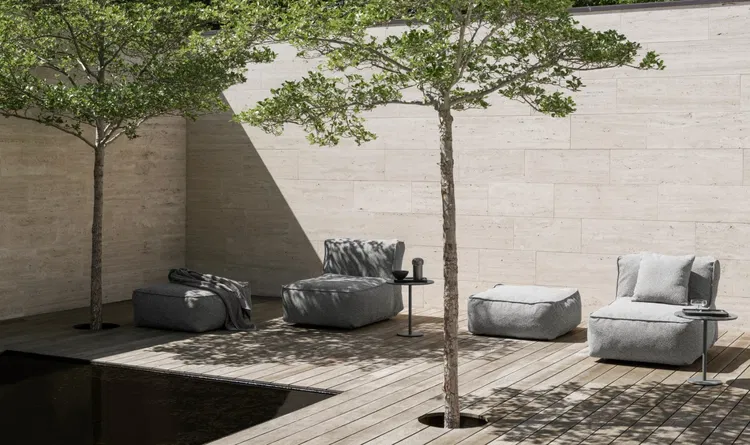 Stylish outdoor seating area with modern furniture and minimalist design in natural light.
